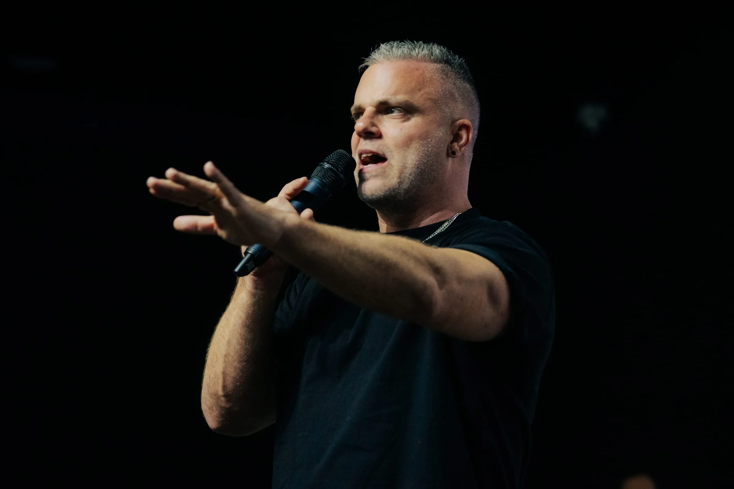 Shawn Gabie teaching against a dark backdrop