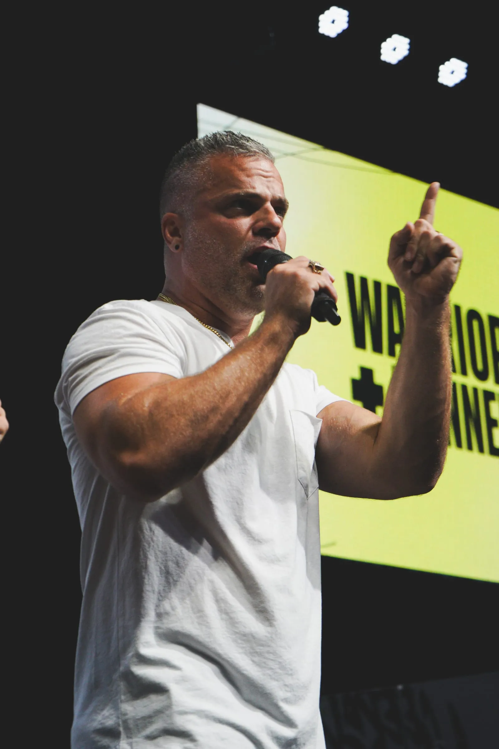 Shawn Gabie speaking passionately at a conference